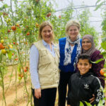 Kate Newton and WFP colleague meet tomato growers - Gaza March 2023 before war