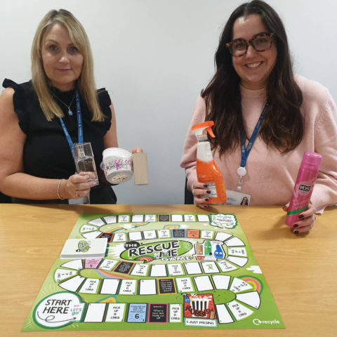 Michelle Bailes, left, and Ariane Heap get ready to introduce the boardgame to schools