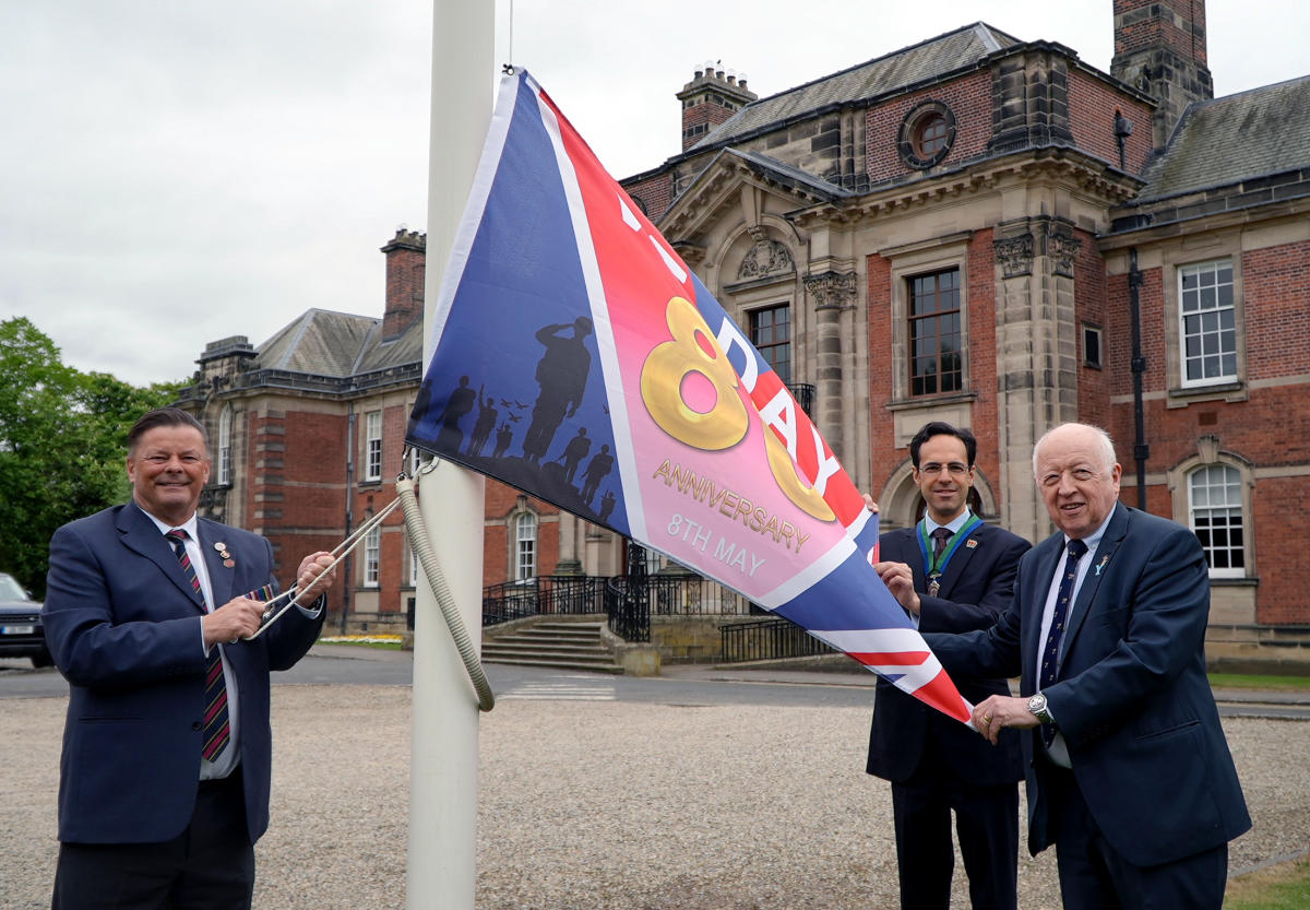 North Yorkshire Council’s Armed Forces champion, Cllr Kevin Foster, the council’s vice-chair, Cllr George Jabbour, and the council’s leader, Cllr Carl Les, at the flag-raising event at County Hall in Northallerton to mark the 80th anniversary of VE Day