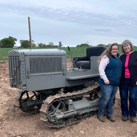 Emily Drury Alcock and Janet Carr with the Cat 10 High Clear that will be debuting at Tractor Fest