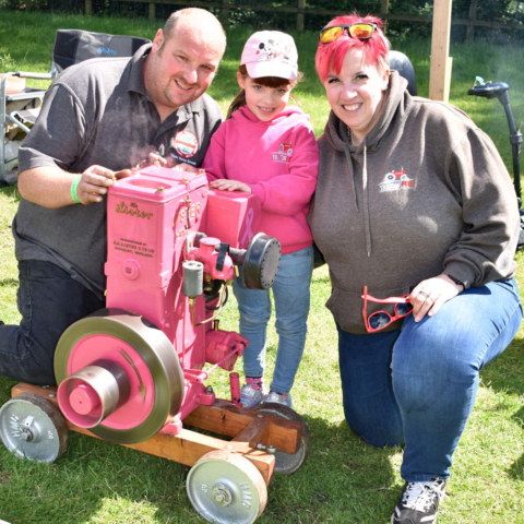 Molly Marshall with her engine and her parents, Sarah Bradshaw and Dan Marshall