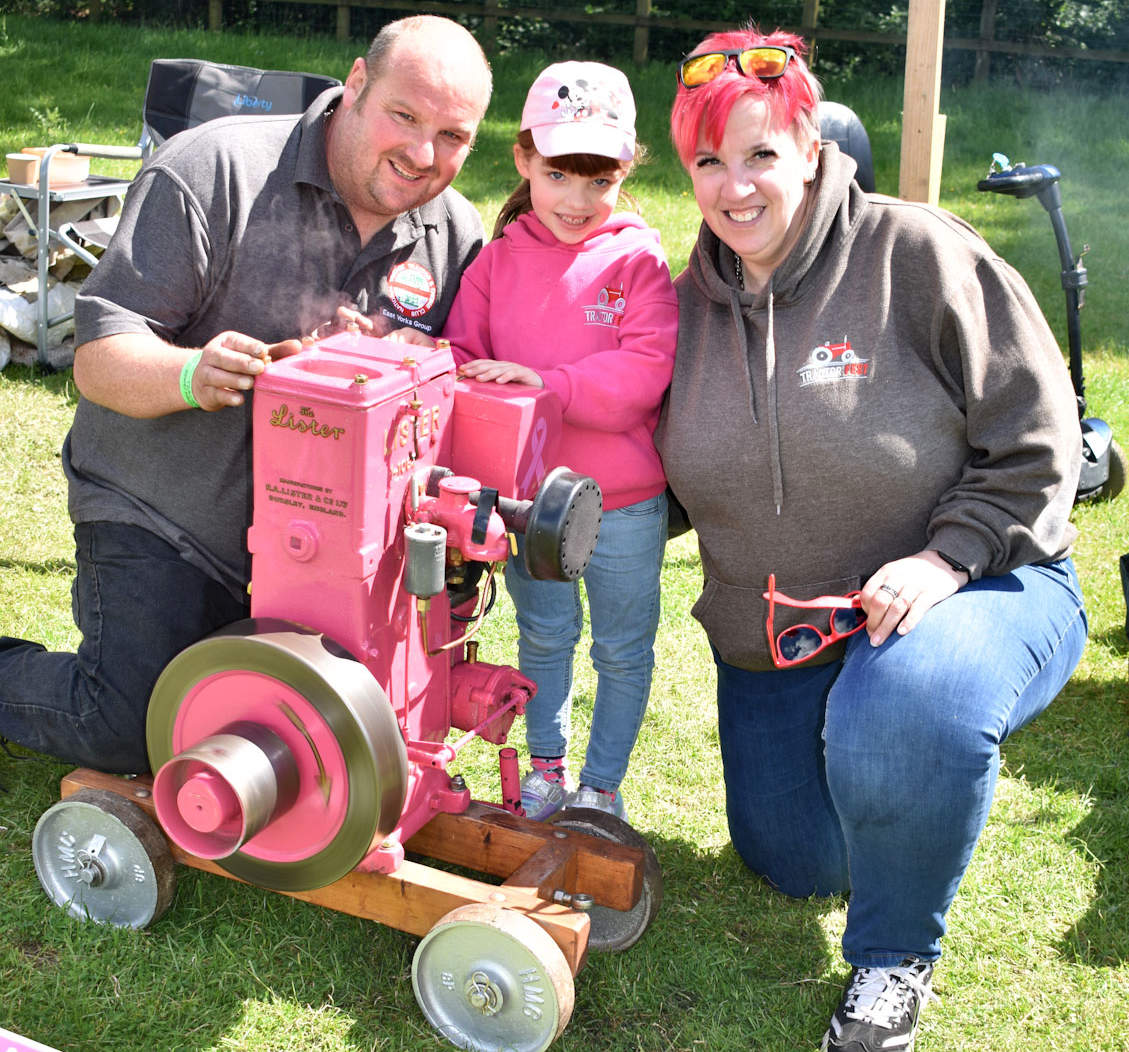 Molly Marshall with her engine and her parents, Sarah Bradshaw and Dan Marshall