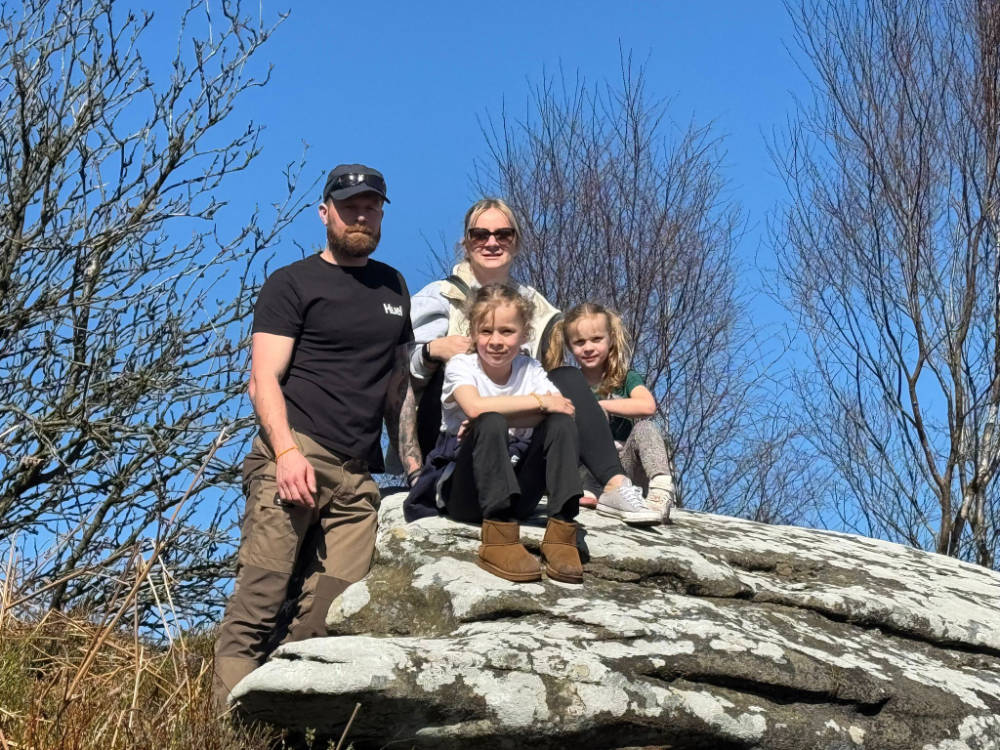 Allan and Leeanne Stewart became foster carers four years ago this month. They are pictured with their daughters Lillian and Daisy