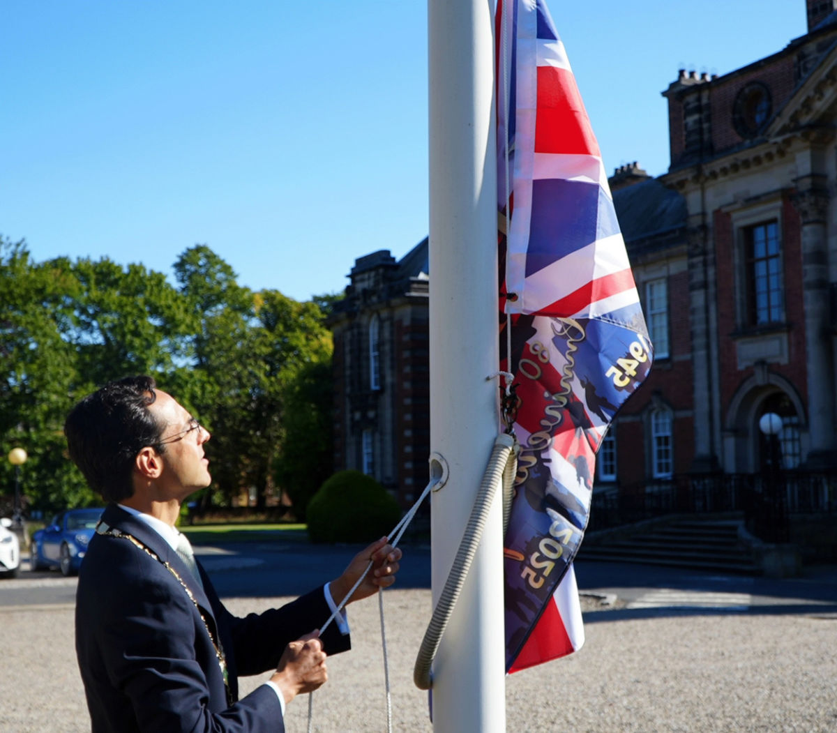 North Yorkshire Council’s chairman, Cllr George Jabbour, raising the flag