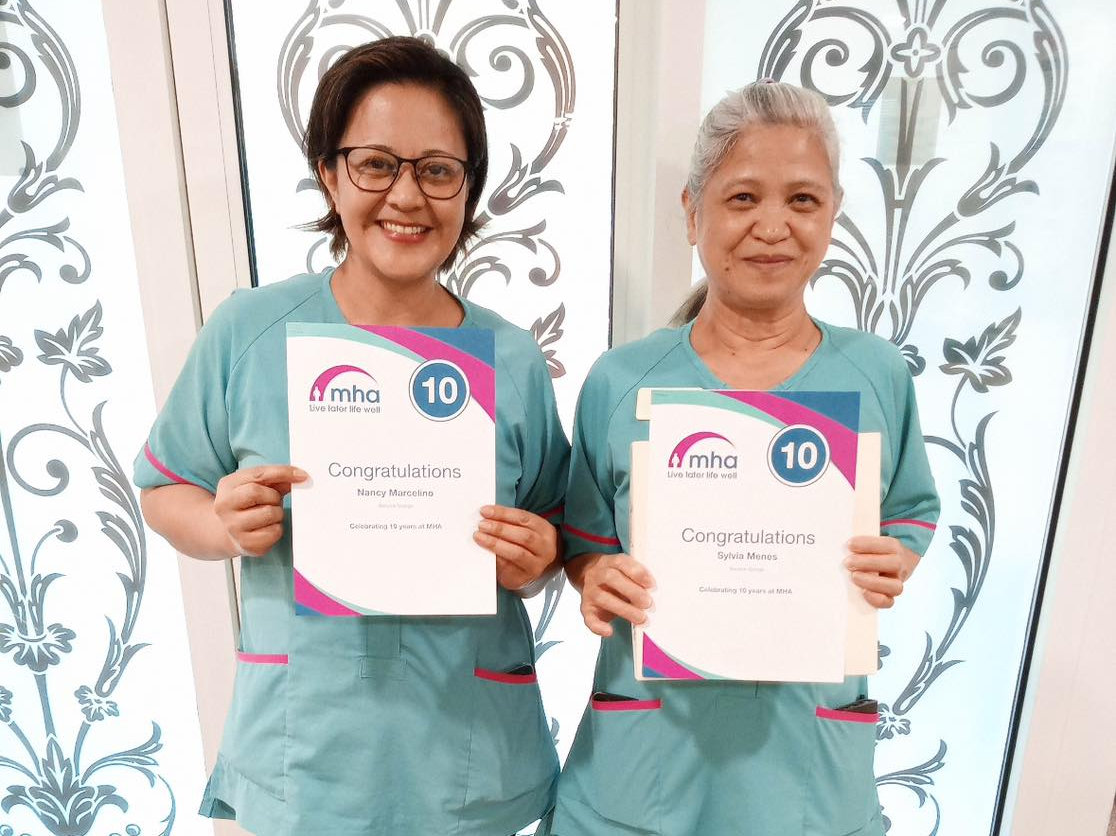 Nancy Marecelino and Eusebia ‘Sylvia’ Menes with their certificates