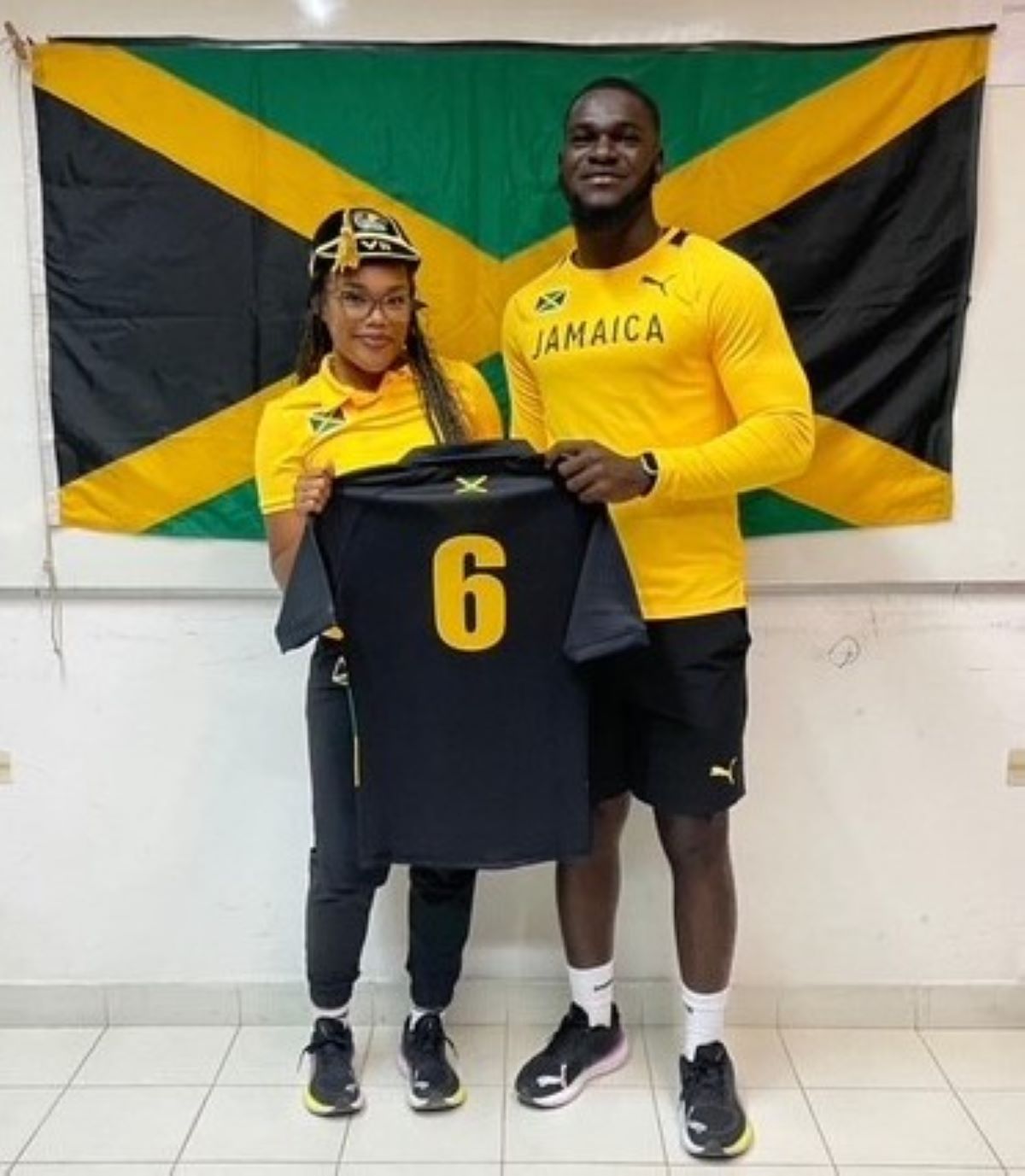 Chevelle is presented with her international shirt by Head Coach Tahj-Jay Lynch