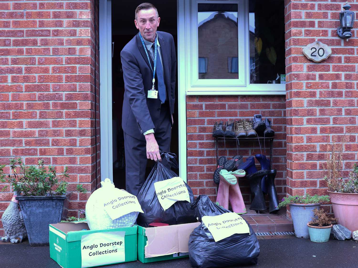 North Yorkshire Council’s executive member for managing our environment, Cllr Richard Foster, with pre-loved clothes and small household items to be picked up by Anglo Doorstep Collections