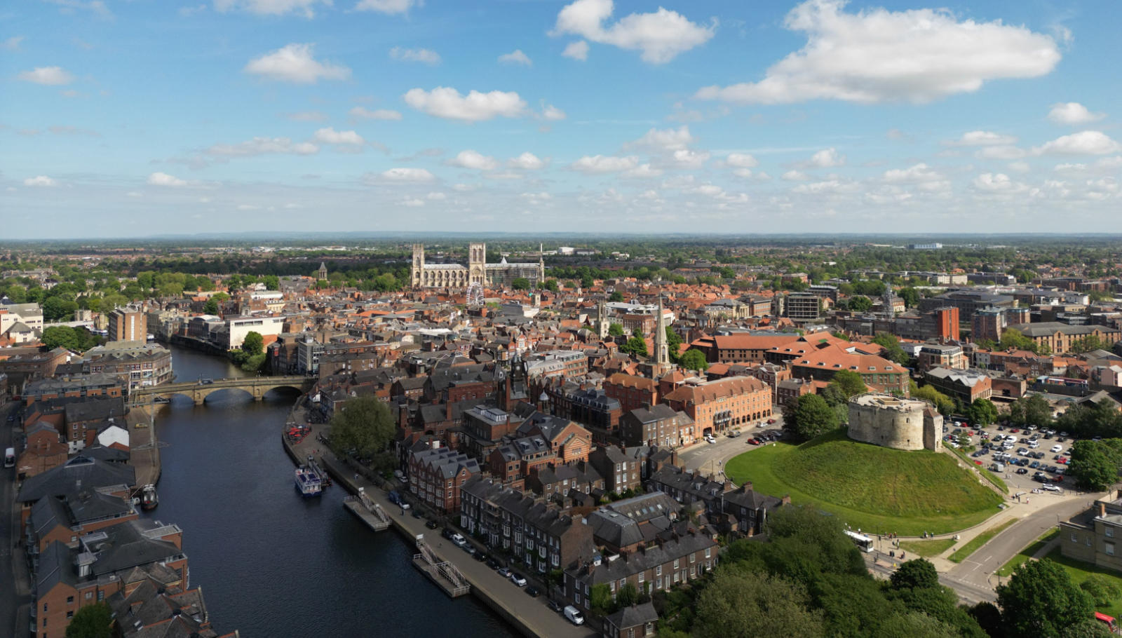 An aerial shot of York. The historic city attracts visitors from across the world to venues such as Clifford’s Tower in the foreground and York Minster
