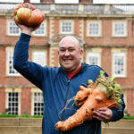 Harrogate Autumn Flower Show Chris Marriott from Mansfield won the heaviest carrot weighing in at 21lbs/9.52544kg and tomato (8.44lbs/9.52544kg)