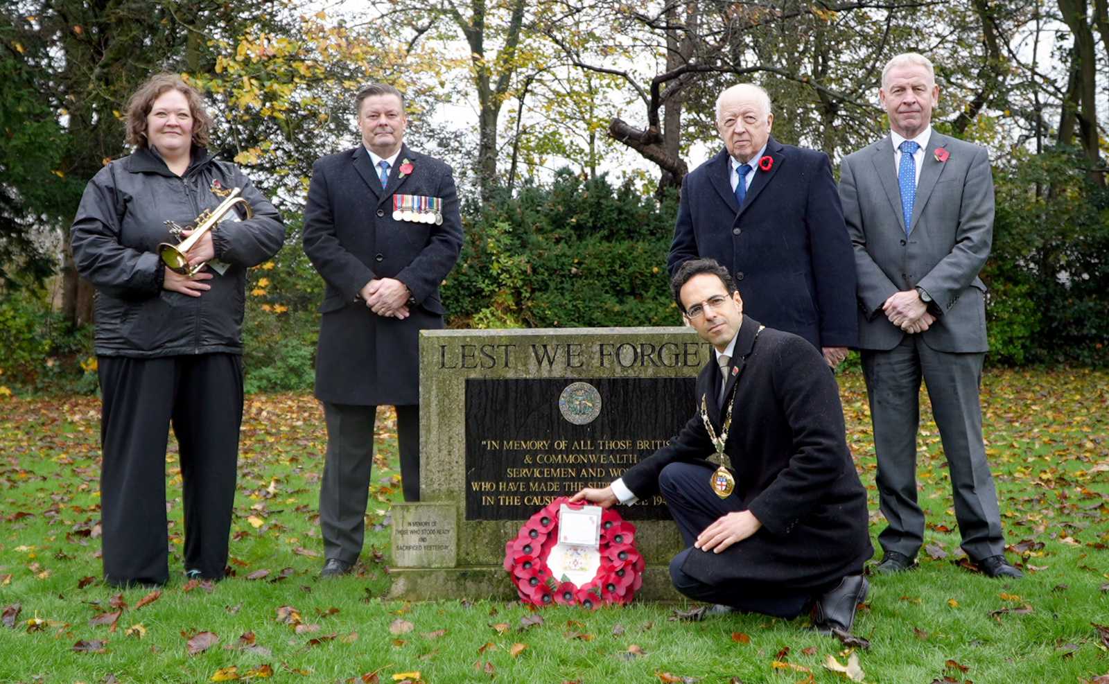 North Yorkshire Council’s chair, Cllr George Jabbour, is pictured in the foreground laying a Remembrance Day wreath at County Hall in Northallerton today (Tuesday, November 11). Behind him are, left to right, Ripon City Band cornet player Jennifer Cash, the council’s Armed Forces champion, Cllr Kevin Foster, council leader Cllr Carl Les and the authority’s chief executive, Richard Flinton