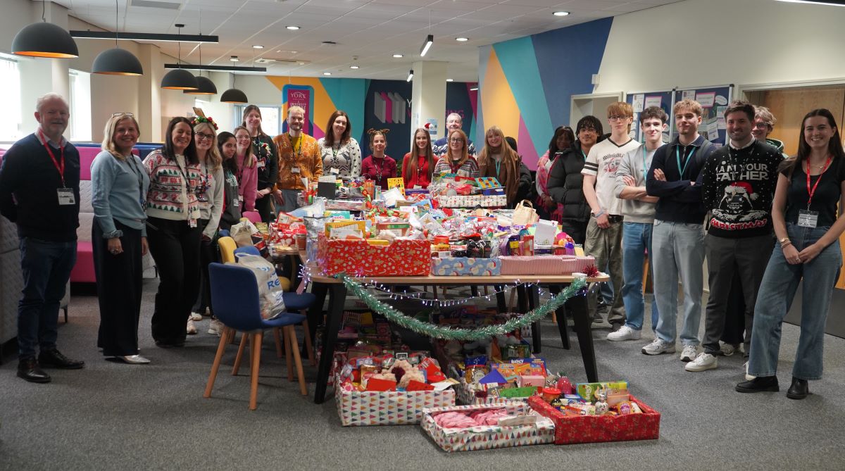 York College staff, students and representatives from The Island York with the hampers on campus