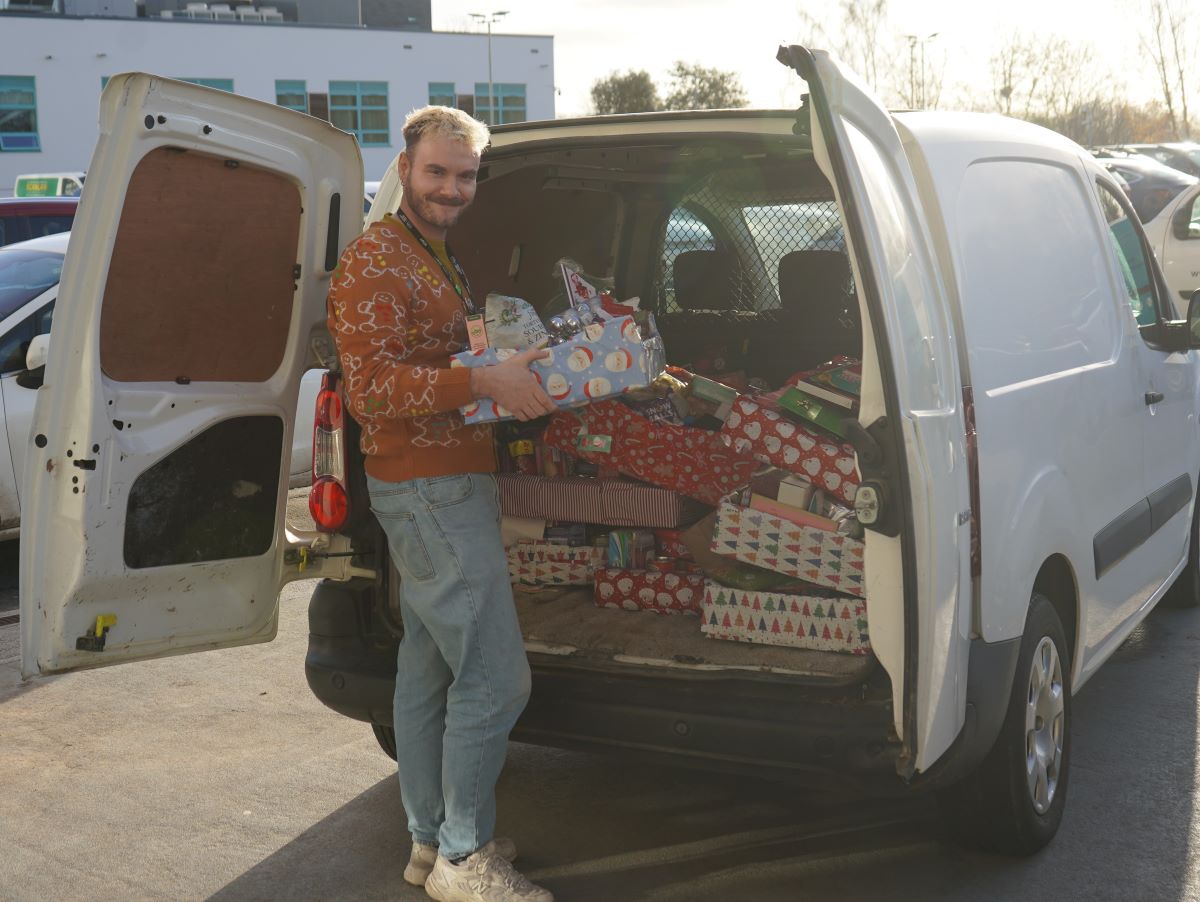Humanities tutor Tom Webster loads a van