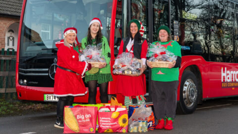 Transdev Christmas Bus – Food Donation, Transdev colleagues and The Joyful Brew volunteers pose in front of our Christmas bus