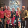 Emily Wragg (centre), Simon Cotton (right) with some of the Candlelighters team who sold raffle tickets at the event