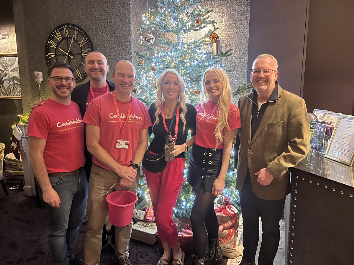 Emily Wragg (centre), Simon Cotton (right) with some of the Candlelighters team who sold raffle tickets at the event