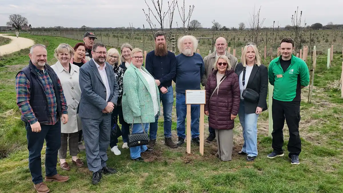 Some of City of York Council's foster carers, together with representatives from the council's Children's Services team and Forestry England next to the new plaque.
