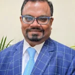 Dr Mani Krishnan