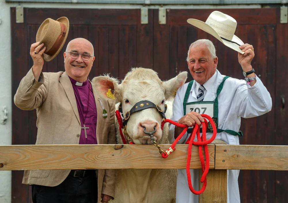 Archbishop of York , Most Rev'd Stephen Cottrell, left with Charolais 'Goldstar April' (364) and handler Barney O'Kane from Northern Ireland.