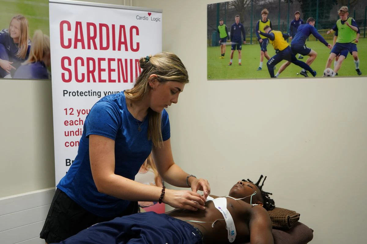 Emma Palmer carries out the simple ECG test on a student