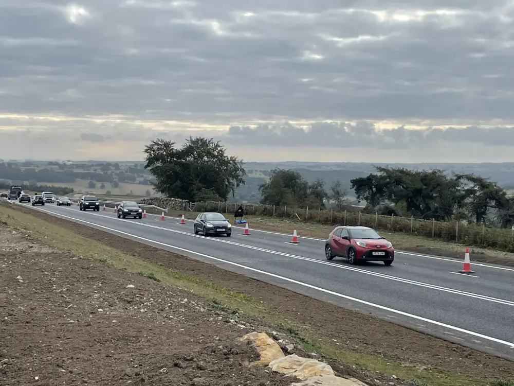 Traffic is pictured travelling along the new stretch of the A59 at Kex Gill today (Tuesday, August 25). The route is seen as one of the most strategically important highways in the country linking the east and west of England.
